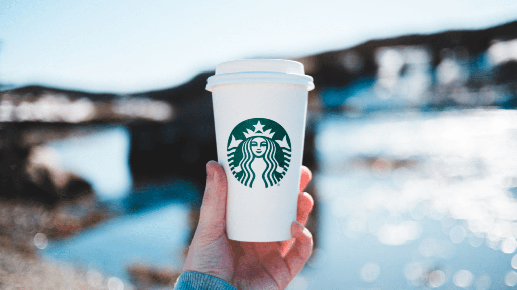 Person holding a Starbucks coffee 